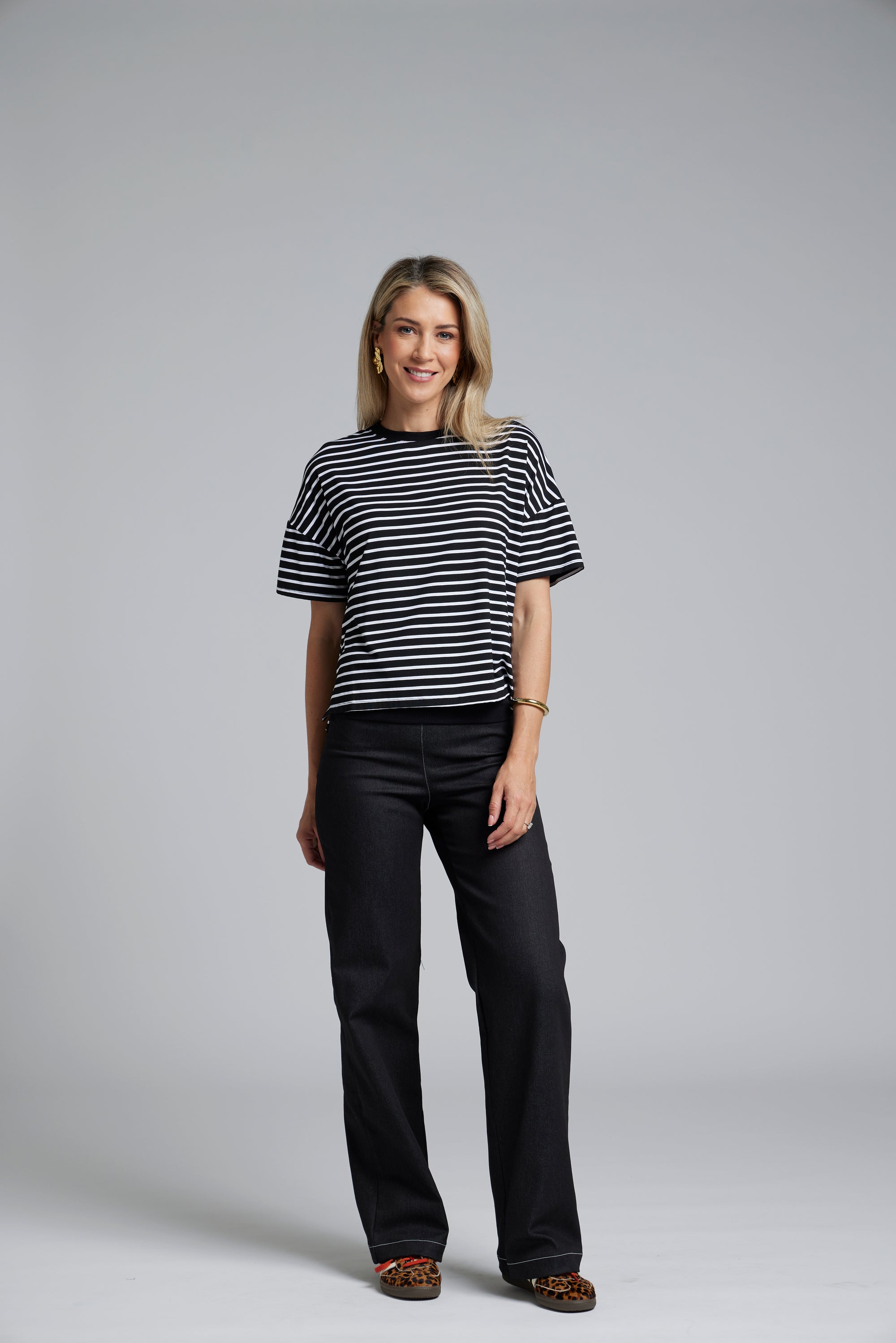 The N-E-S DollyB Denim Pants – a wide-leg stretch denim pant with fold-down rib waistband and contrast stitching. Available in blue or black denim. NZ made.