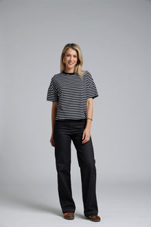 The N-E-S DollyB Denim Pants – a wide-leg stretch denim pant with fold-down rib waistband and contrast stitching. Available in blue or black denim. NZ made.