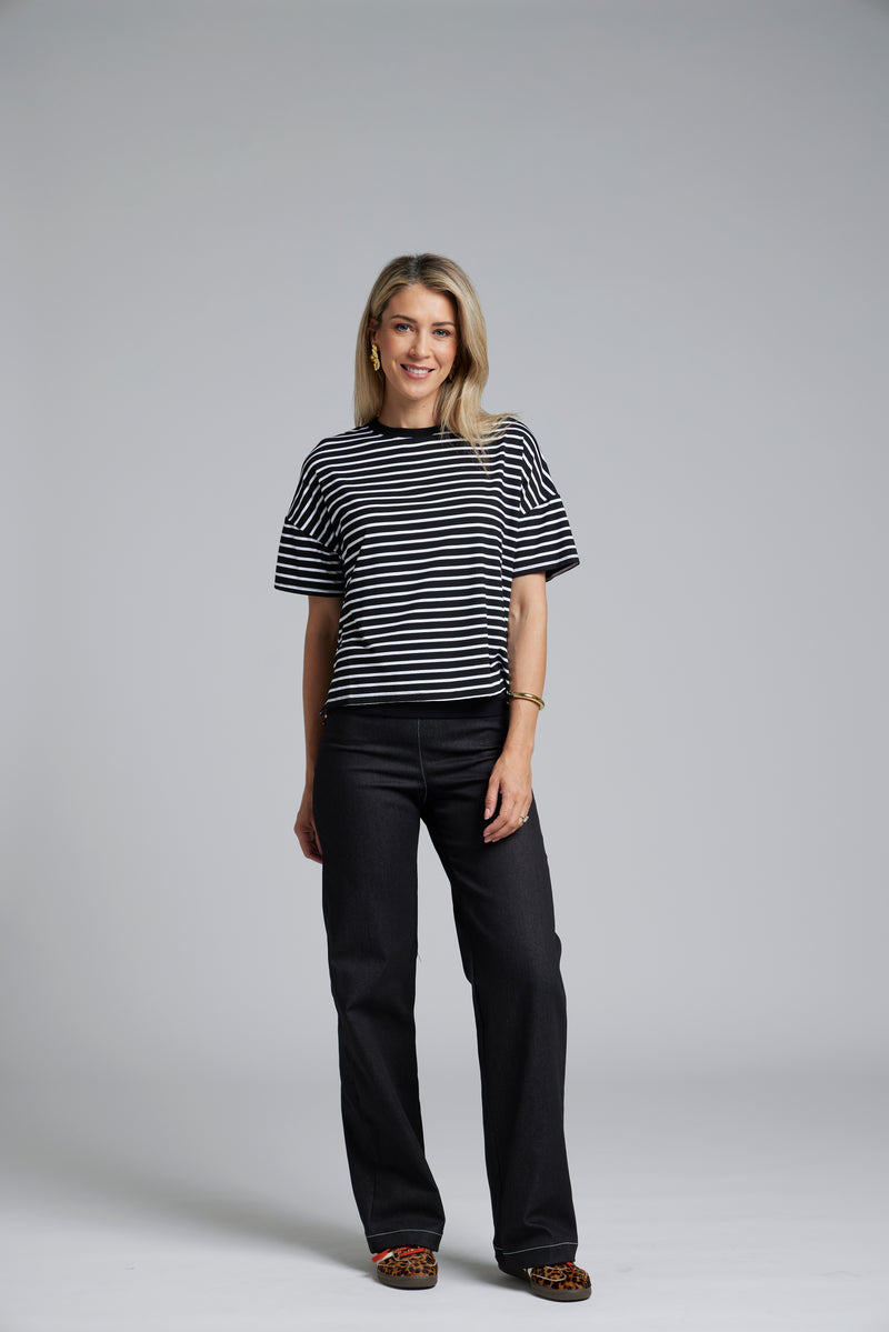 The N-E-S DollyB Denim Pants – a wide-leg stretch denim pant with fold-down rib waistband and contrast stitching. Available in blue or black denim. NZ made.