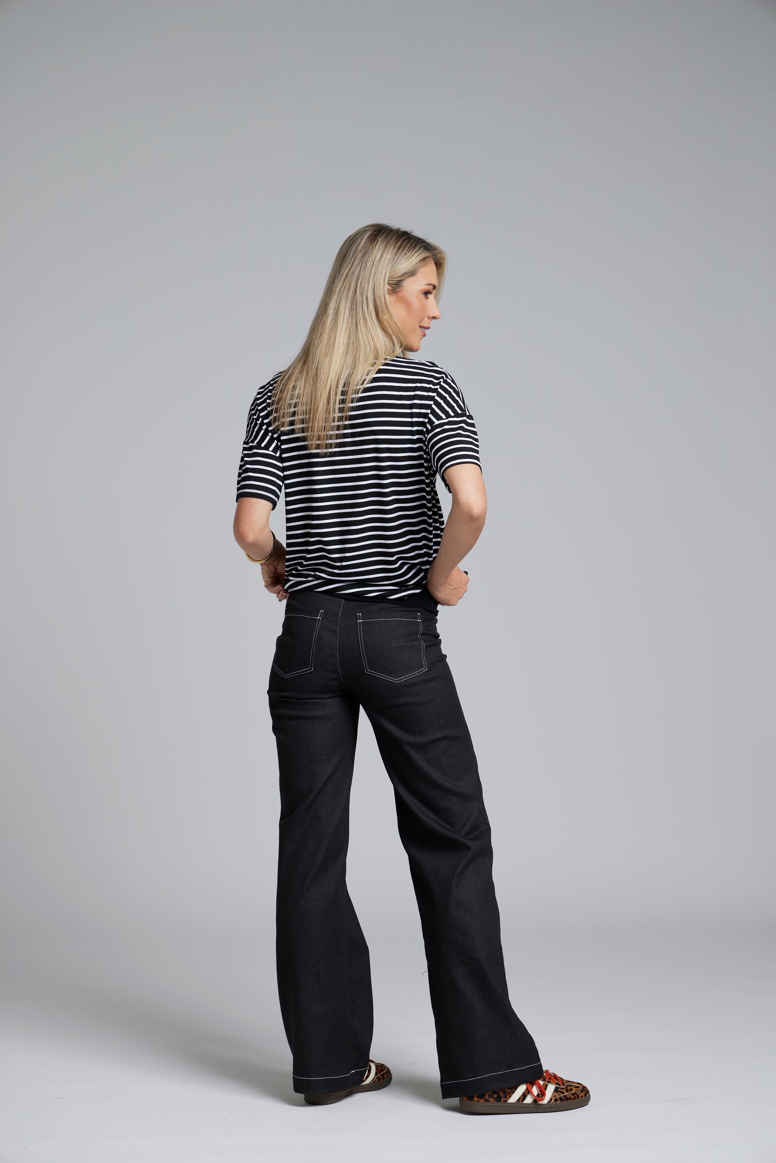 The N-E-S DollyB Denim Pants – a wide-leg stretch denim pant with fold-down rib waistband and contrast stitching. Available in blue or black denim. NZ made.