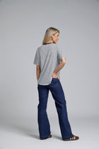 The N-E-S DollyB Denim Pants – a wide-leg stretch denim pant with fold-down rib waistband and contrast stitching. Available in blue or black denim. NZ made.