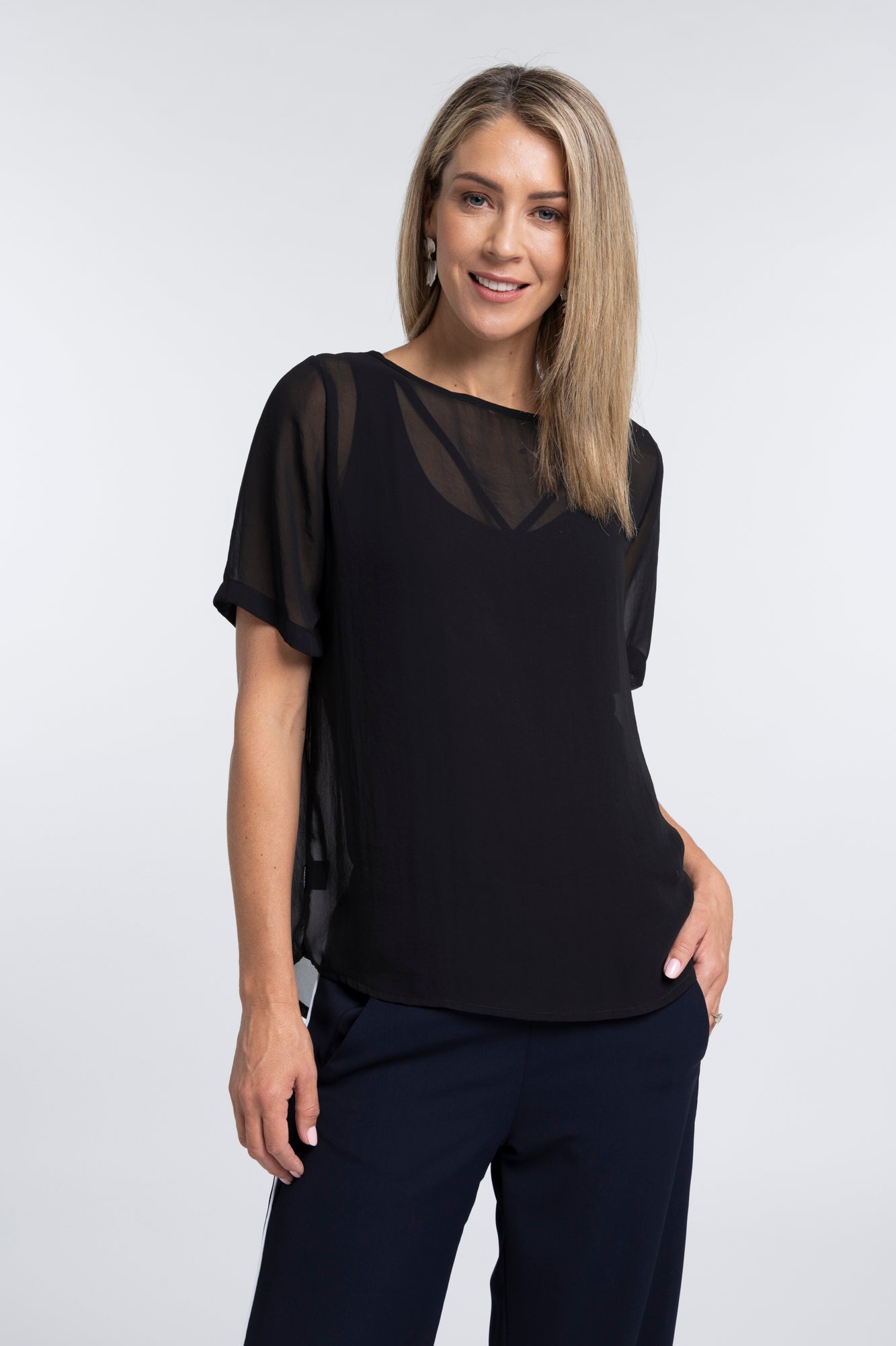 The N-E-S Charlie Top – a lightweight chiffon tee with relaxed fit, sheer layering and travel-friendly fabric. Designed and made in NZ.