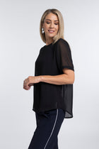 The N-E-S Charlie Top – a lightweight chiffon tee with relaxed fit, sheer layering and travel-friendly fabric. Designed and made in NZ.