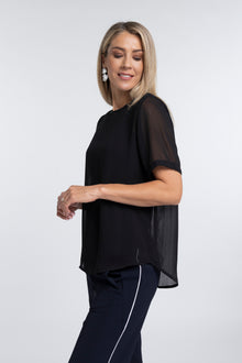 The N-E-S Charlie Top – a lightweight chiffon tee with relaxed fit, sheer layering and travel-friendly fabric. Designed and made in NZ.