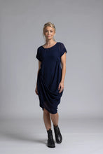 Load image into Gallery viewer, The NES Flow Dress is a multi-seasonal, versatile style that seamlessly transitions from casual to formal occasions. This dress offers a variety of styling options—wear it draped down across the front for a relaxed look, or cinch it up at the side using the adjustable side button and hem loopers for a more structured appearance. The perfect balance of comfort and elegance, this dress can be styled with our Lattice Slip
