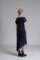 The NES Flow Dress is a multi-seasonal, versatile style that seamlessly transitions from casual to formal occasions. This dress offers a variety of styling options—wear it draped down across the front for a relaxed look, or cinch it up at the side using the adjustable side button and hem loopers for a more structured appearance. The perfect balance of comfort and elegance, this dress can be styled with our Lattice Slip