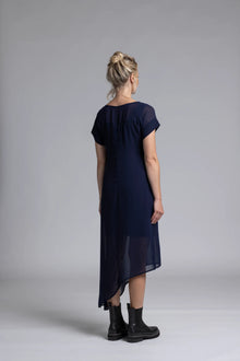 The NES Flow Dress is a multi-seasonal, versatile style that seamlessly transitions from casual to formal occasions. This dress offers a variety of styling options—wear it draped down across the front for a relaxed look, or cinch it up at the side using the adjustable side button and hem loopers for a more structured appearance. The perfect balance of comfort and elegance, this dress can be styled with our Lattice Slip