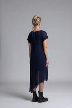 Load image into Gallery viewer, The NES Flow Dress is a multi-seasonal, versatile style that seamlessly transitions from casual to formal occasions. This dress offers a variety of styling options—wear it draped down across the front for a relaxed look, or cinch it up at the side using the adjustable side button and hem loopers for a more structured appearance. The perfect balance of comfort and elegance, this dress can be styled with our Lattice Slip
