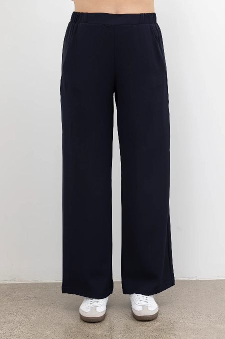 The NES Gin Pants by N-E-S – a best-selling classic with a flattering fit, flat front, elastic back and new piping detail. Breathable, timeless and NZ made.