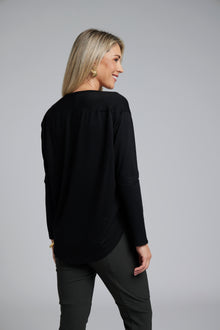 The NES Reya Top by N-E-S – a soft 100% merino long sleeve top with scoop neck, curved hem and bias cut sleeves. A winter essential. NZ made.
