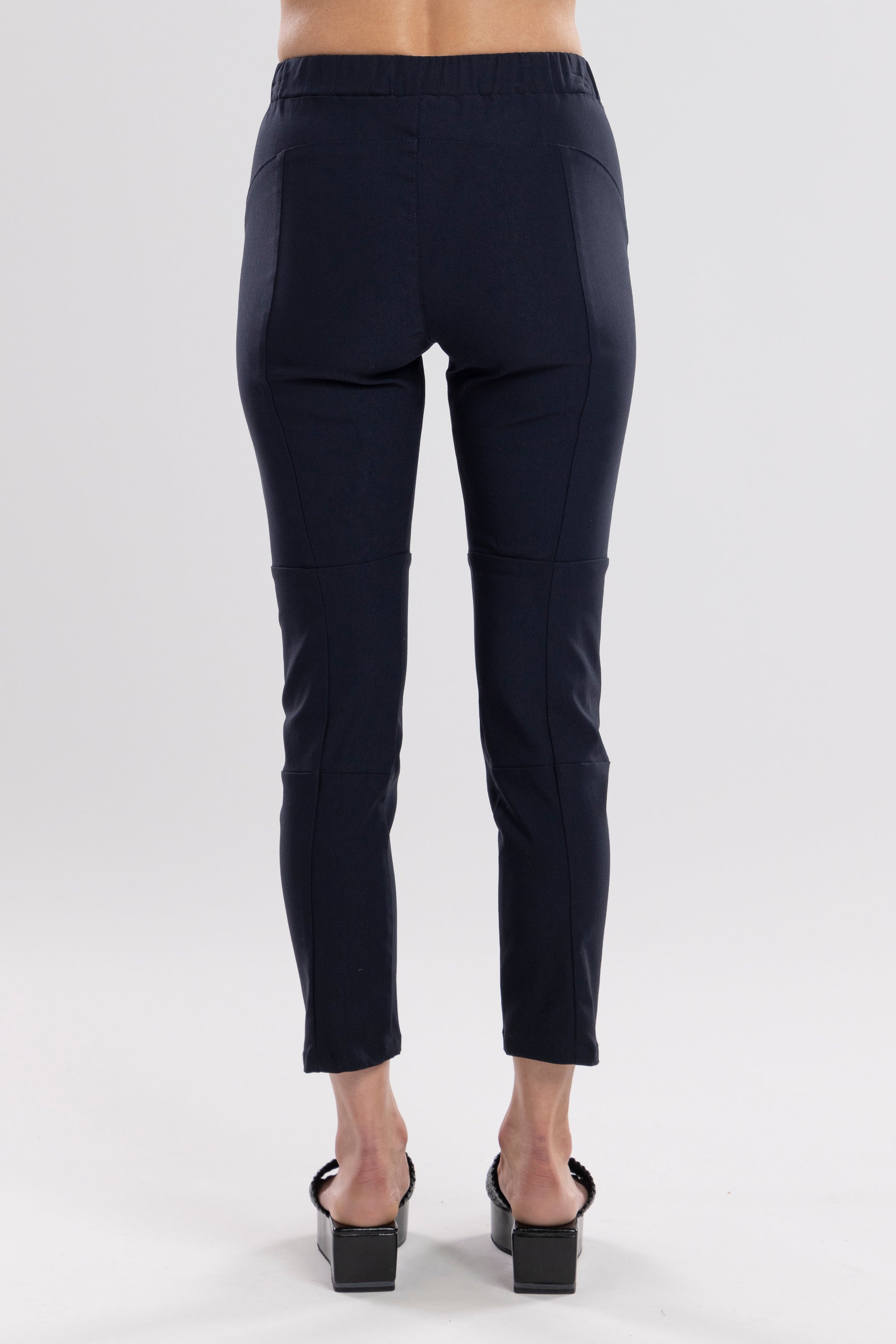 NES Section Pant is the perfect blend of style and comfort, featuring fabulous spliced detailing that adds a modern edge to your look. With a sleek flat front and an elasticated back, these pants offer a comfortable and flattering fit. Practical side pockets enhance the design, while the length finishes just above the ankle, creating a chic, tailored silhouette. Ideal for both casual and dressier occasions
