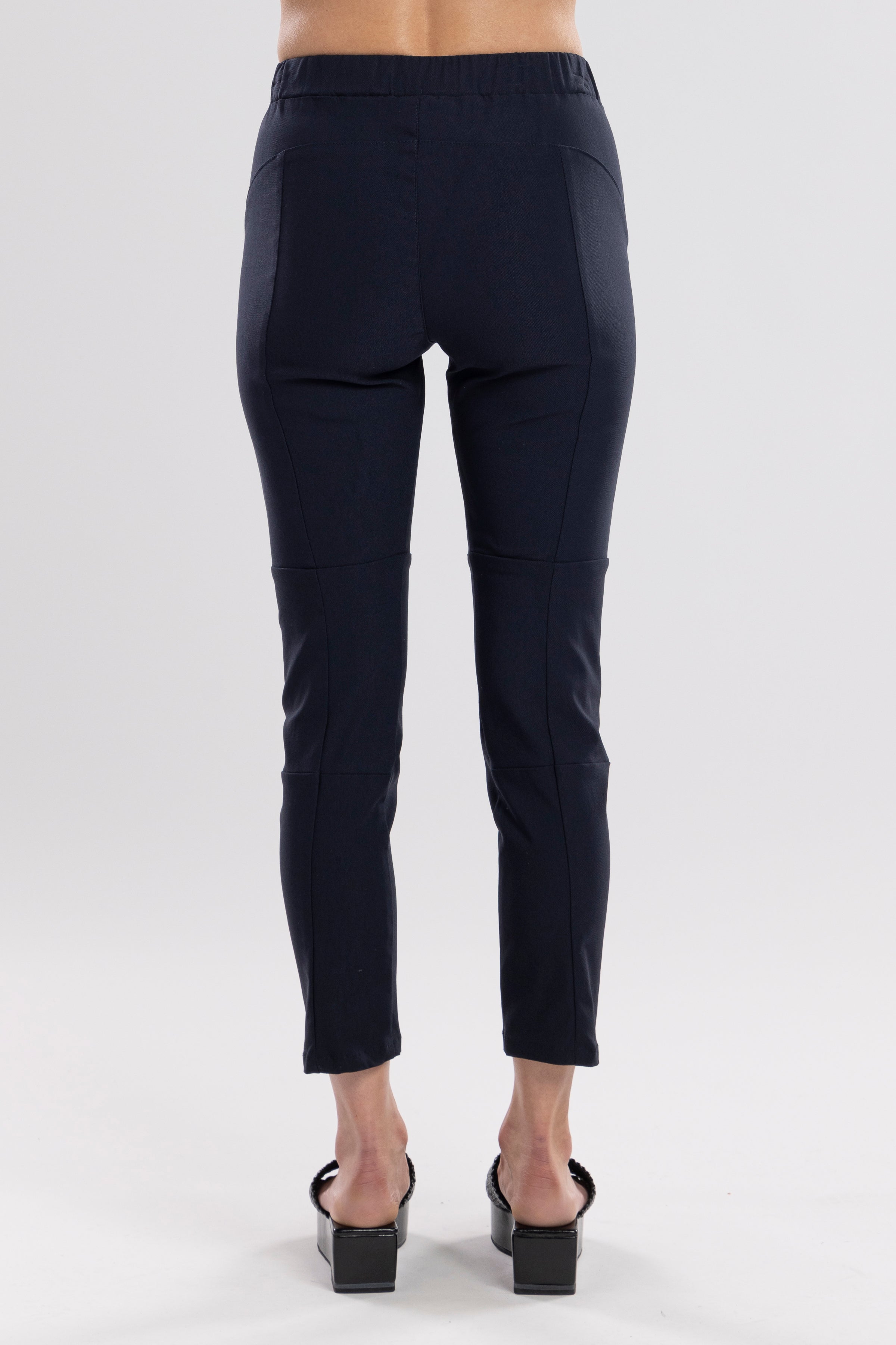 NES Section Pant is the perfect blend of style and comfort, featuring fabulous spliced detailing that adds a modern edge to your look. With a sleek flat front and an elasticated back, these pants offer a comfortable and flattering fit. Practical side pockets enhance the design, while the length finishes just above the ankle, creating a chic, tailored silhouette. Ideal for both casual and dressier occasions