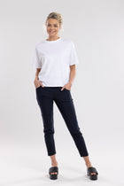NES Section Pant is the perfect blend of style and comfort, featuring fabulous spliced detailing that adds a modern edge to your look. With a sleek flat front and an elasticated back, these pants offer a comfortable and flattering fit. Practical side pockets enhance the design, while the length finishes just above the ankle, creating a chic, tailored silhouette. Ideal for both casual and dressier occasions