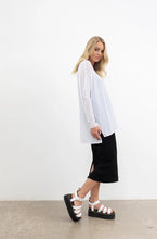 Load image into Gallery viewer, NES Step Mesh top, Black. Our Step Mesh Top is soft and floaty. Easy wearing, made in a sheer mesh fabric, features side splits a hi-low hemline, wide neckline. Fitted raw edge sleeved.

