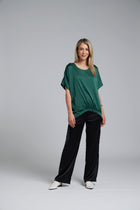 The NES Gin Satin Pant – a straight leg hammered satin pant with flat front, elastic back and fluid drape. Available in Black and Ink. NZ made.