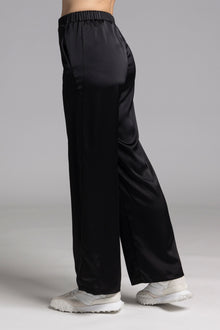 The NES Gin Satin Pant – a straight leg hammered satin pant with flat front, elastic back and fluid drape. Available in Black and Ink. NZ made.