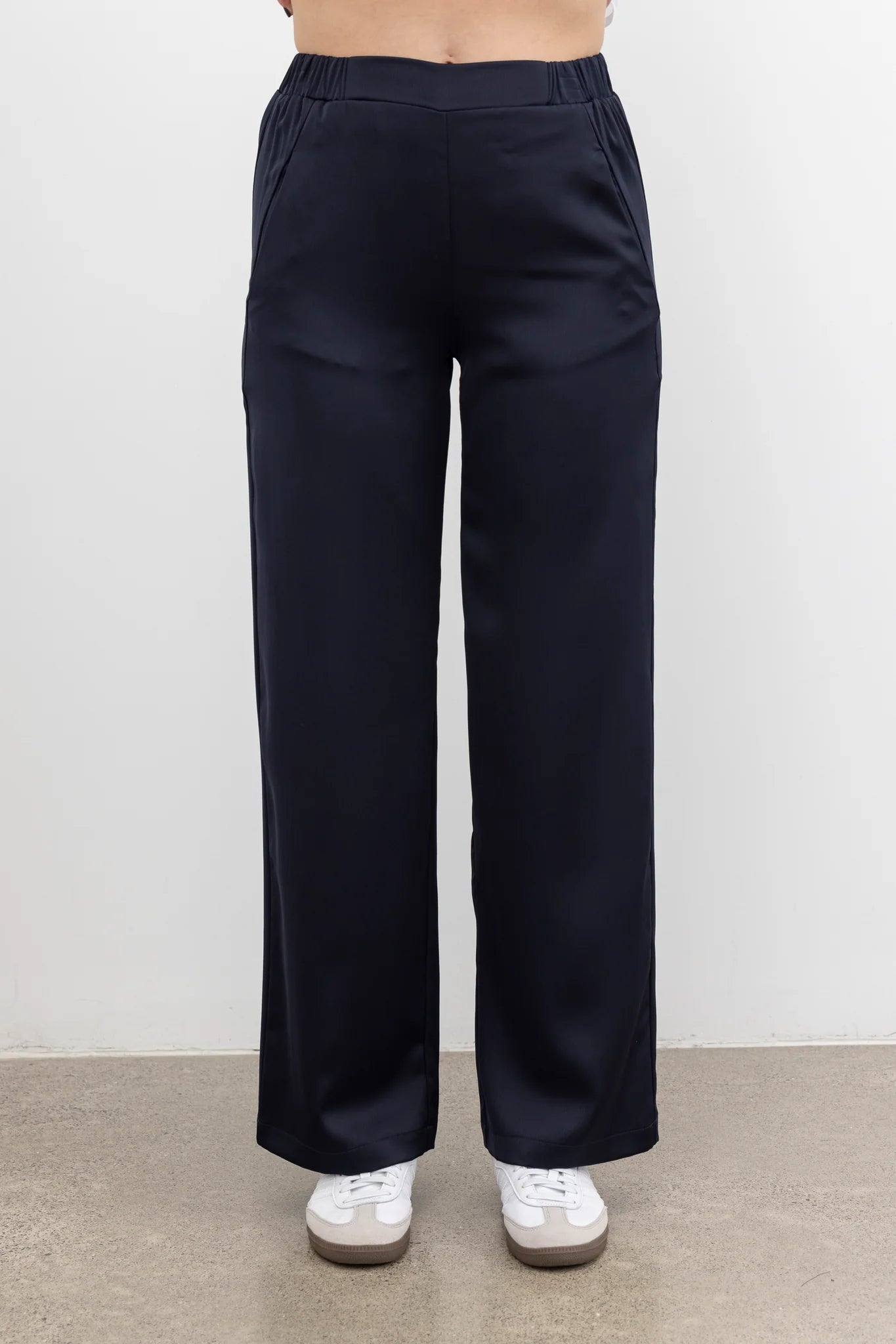 The NES Gin Satin Pant – a straight leg hammered satin pant with flat front, elastic back and fluid drape. Available in Black and Ink. NZ made.