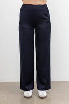 The NES Gin Satin Pant – a straight leg hammered satin pant with flat front, elastic back and fluid drape. Available in Black and Ink. NZ made.