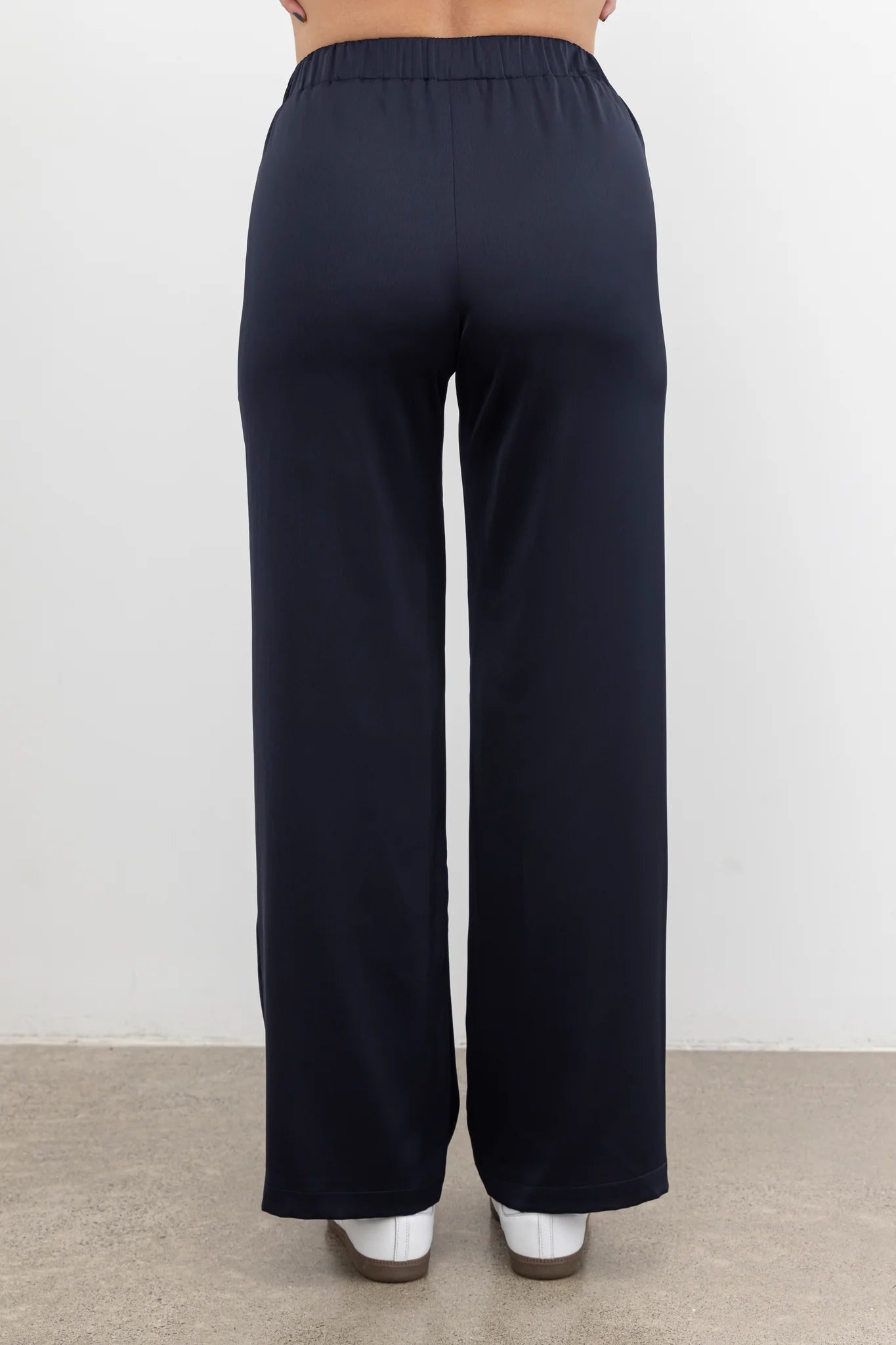 The NES Gin Satin Pant – a straight leg hammered satin pant with flat front, elastic back and fluid drape. Available in Black and Ink. NZ made.