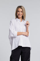 The NES Zola Linen Shirt – an oversized linen-cotton shirt with contrast stitching and drop-back detail. Lightweight and NZ made.