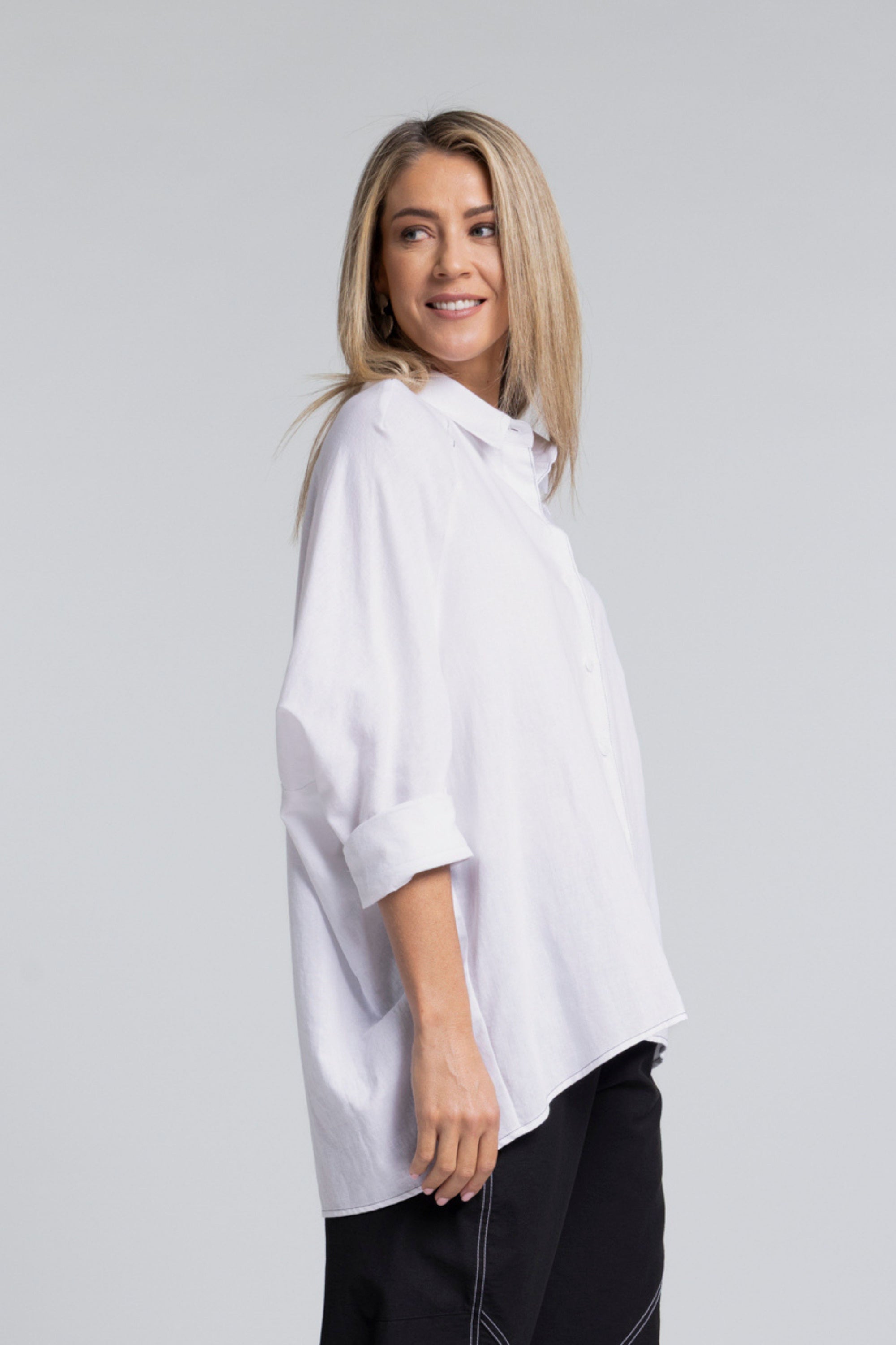 The NES Zola Linen Shirt – an oversized linen-cotton shirt with contrast stitching and drop-back detail. Lightweight and NZ made.