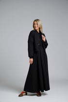 The NES Zadie Skirt by N-E-S – a full length ponte skirt with outward pleats, elastic back insert and clean modern fit. NZ made in Black or Latte.