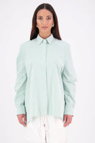 The NES Zola Shirt – an oversized seersucker shirt with kimono shape and drop-back detail. Lightweight, modern and NZ made.