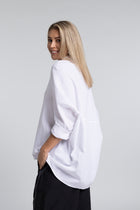 The NES Zola Linen Shirt – an oversized linen-cotton shirt with contrast stitching and drop-back detail. Lightweight and NZ made.