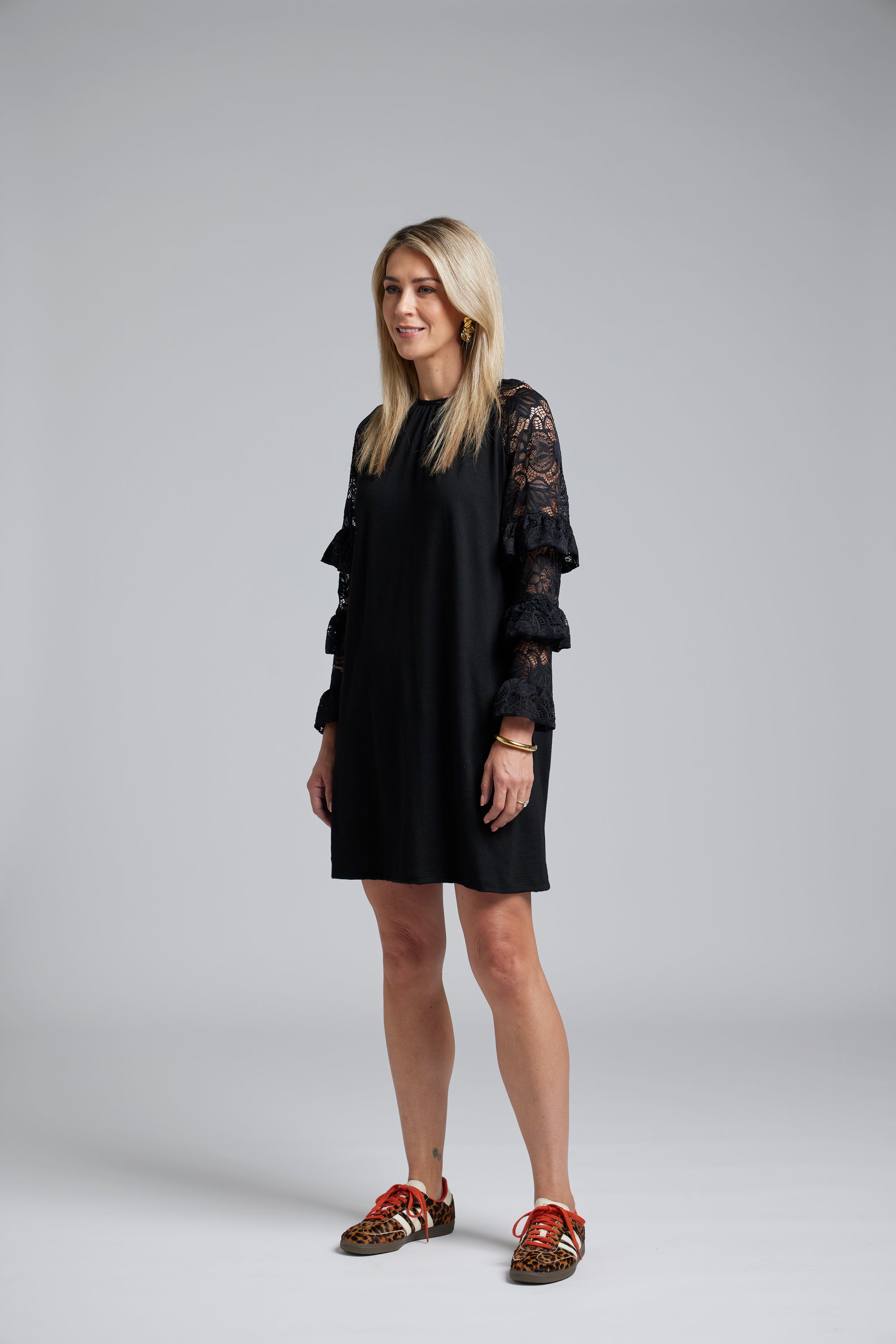 NES Luxa Dress by N-E-S – a black merino dress with sculptural ruffled lace sleeves, subtle gathers and above-knee length. Bold, modern and NZ made.