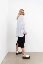 Load image into Gallery viewer, NES Step Mesh top, Black. Our Step Mesh Top is soft and floaty. Easy wearing, made in a sheer mesh fabric, features side splits a hi-low hemline, wide neckline. Fitted raw edge sleeved.

