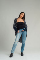 NES Voltage cardi is perfect for layering or a great trans-seasonal piece, Flattering batwing sleeve, Dress up or down, Can be worn multiple ways - by flipping the cardi upside down so the hem is worn around your neck. by doing this you will get either a shorter hip length cardi or a longer length cardi - falling mid thigh (at the back) 100% merino