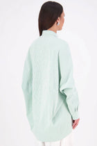 The NES Zola Shirt – an oversized seersucker shirt with kimono shape and drop-back detail. Lightweight, modern and NZ made.