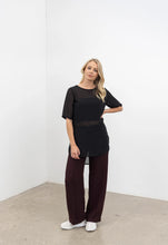 Load image into Gallery viewer, NES Zoe Top Ink. Semi-sheer, stylish floaty relaxed t-shirt style top.
Features: Curved front neckline and V back neck (can be reversed), even hem line, side splits
Composition: Poly Chiffon
