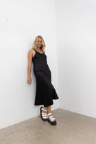 Vslip Dress is a great versatle style to have in your wardrobe. This style can be worn as a slip or a dress.

Tank style straps - cover a bra or if no bra is worn the front facing provides good coverage.

Back strap detailing - button and button holes. Allow the straps to be easily adjusted and crossed over to create a criss X back.

Cut on the bias this dress is figure hugging.

to dress the Vslip as a slip - layer the Civita dress or flow dress over the top to create texture and layering to your fav NES d