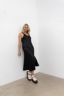 Vslip Dress is a great versatle style to have in your wardrobe. This style can be worn as a slip or a dress.

Tank style straps - cover a bra or if no bra is worn the front facing provides good coverage.

Back strap detailing - button and button holes. Allow the straps to be easily adjusted and crossed over to create a criss X back.

Cut on the bias this dress is figure hugging.

to dress the Vslip as a slip - layer the Civita dress or flow dress over the top to create texture and layering to your fav NES d