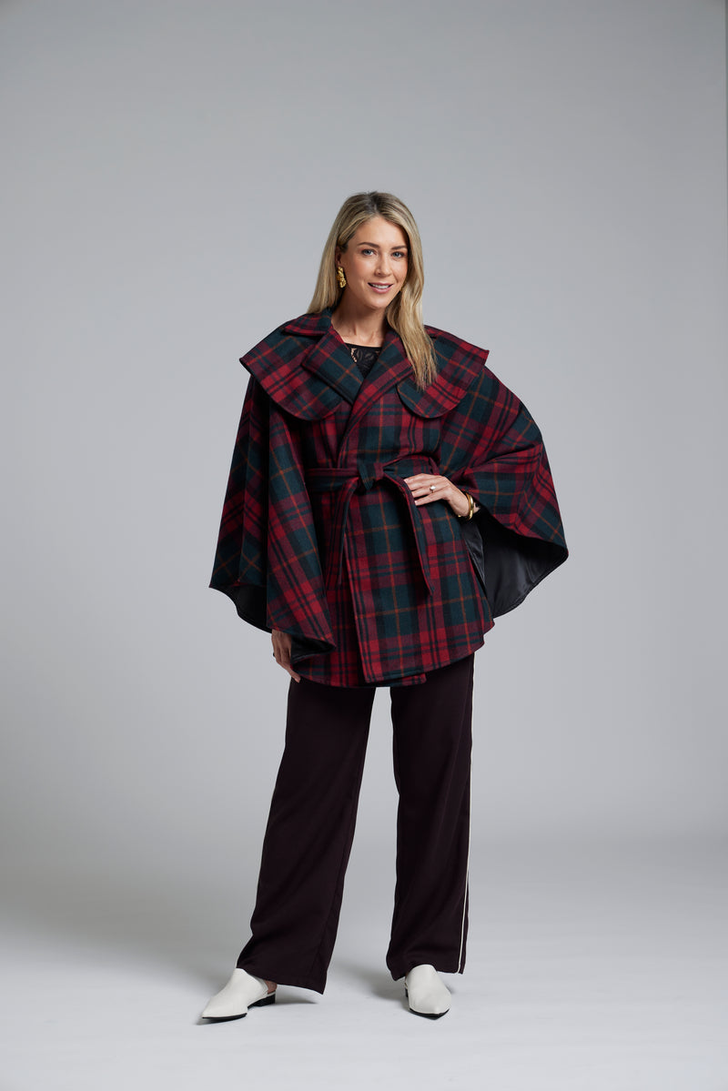 The NES Suri Cape by N-E-S – a trench-inspired wool cape with waist tie, lapel and full lining. A refined winter show stopper. NZ made.