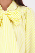 The N-E-S Nova Shirt blends the best of our Ayla, Mon, and Del shirts into one must-have wardrobe piece. Featuring elbow-length sleeves, a soft drop hem at the front and back, and a playful neck tie that can be styled multiple ways—bowed, looped, or reversed and tied at the back. Designed for versatility and charm, the Nova Shirt is a timeless addition to elevate your everyday style.

Our model is 174cm and wear a XS/S (8-10)

Composition: Cotton, bemburg&nbsp;

Designed and Made in New Zealand