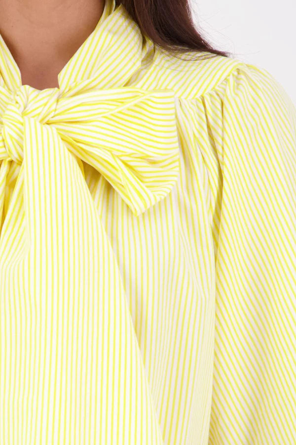 The N-E-S Nova Shirt blends the best of our Ayla, Mon, and Del shirts into one must-have wardrobe piece. Featuring elbow-length sleeves, a soft drop hem at the front and back, and a playful neck tie that can be styled multiple ways—bowed, looped, or reversed and tied at the back. Designed for versatility and charm, the Nova Shirt is a timeless addition to elevate your everyday style.

Our model is 174cm and wear a XS/S (8-10)

Composition: Cotton, bemburg&nbsp;

Designed and Made in New Zealand