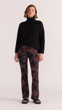 Load image into Gallery viewer, The Staple the Label Olina Mesh Pants feature the same moody floral print as the matching top, crafted in a sheer stretch mesh that moves with you. With a flattering flared leg and pull-on waistband, these pants bring serious 90s energy with a modern edge.
- Sheer mesh fabric with all-over black floral print
- Elastic waistband for comfort and ease
- Slim fit through the leg with a slight flare
