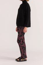 Load image into Gallery viewer, The Staple the Label Olina Mesh Pants feature the same moody floral print as the matching top, crafted in a sheer stretch mesh that moves with you. With a flattering flared leg and pull-on waistband, these pants bring serious 90s energy with a modern edge.
- Sheer mesh fabric with all-over black floral print
- Elastic waistband for comfort and ease
- Slim fit through the leg with a slight flare
