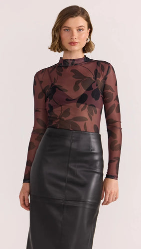 Add a little edge to your wardrobe with the Staple the Label Olina Mesh Top - where sheer sophistication meets bold print energy. This figure-hugging, long sleeve top features a rich burgundy base layered with abstract black florals for a dramatic, moody look that pairs perfectly with denim or leather. The high neckline and mesh fabrication strike the perfect balance between sultry and sleek.
- Abstract floral print in tonal black
- Soft mesh fabric with stretch
