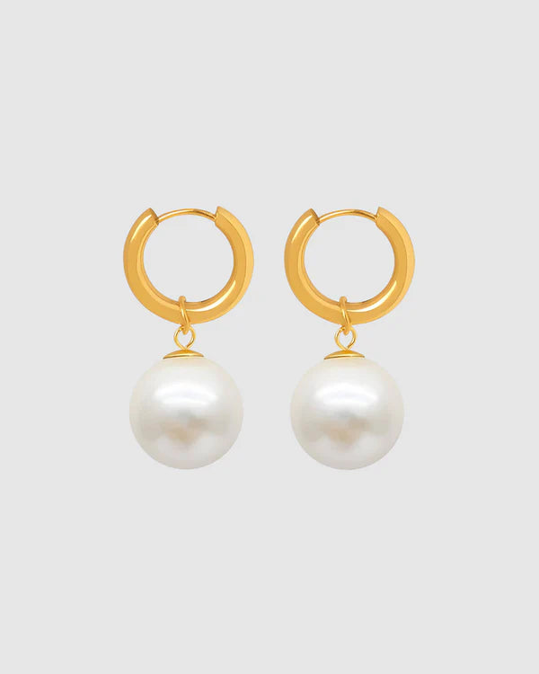 A perfect fusion of modern elegance and timeless charm—the Castel &amp; Co Orb Earrings feature a sleek, polished sphere paired with a delicate pearl drop for effortless sophistication. The contrast between the luminous pearl and the structured orb creates a refined yet contemporary look, making these earrings ideal for both everyday luxury and special occasions. Classic, graceful, and endlessly wearable.

Main material: gold plating, stainless steel
Closure type: congo
Earrings size: 1 x 2.5 cm
Waterproof 