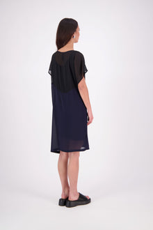 NES Norton Dress is a effortlessly chic chiffon piece that offers versatile styling options. With a flattering length that finishes just above the knee, this dress features a contrast top panel for added visual interest. Perfect for both dressing up or down, the Norton Dress can be worn alone or layered over skinny pants for a different look.