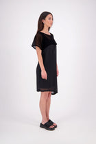 NES Norton Dress is a effortlessly chic chiffon piece that offers versatile styling options. With a flattering length that finishes just above the knee, this dress features a contrast top panel for added visual interest. Perfect for both dressing up or down, the Norton Dress can be worn alone or layered over skinny pants for a different look.