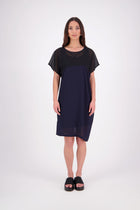 NES Norton Dress is a effortlessly chic chiffon piece that offers versatile styling options. With a flattering length that finishes just above the knee, this dress features a contrast top panel for added visual interest. Perfect for both dressing up or down, the Norton Dress can be worn alone or layered over skinny pants for a different look.
