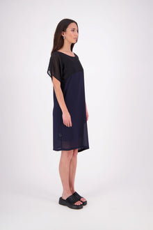 NES Norton Dress is a effortlessly chic chiffon piece that offers versatile styling options. With a flattering length that finishes just above the knee, this dress features a contrast top panel for added visual interest. Perfect for both dressing up or down, the Norton Dress can be worn alone or layered over skinny pants for a different look.