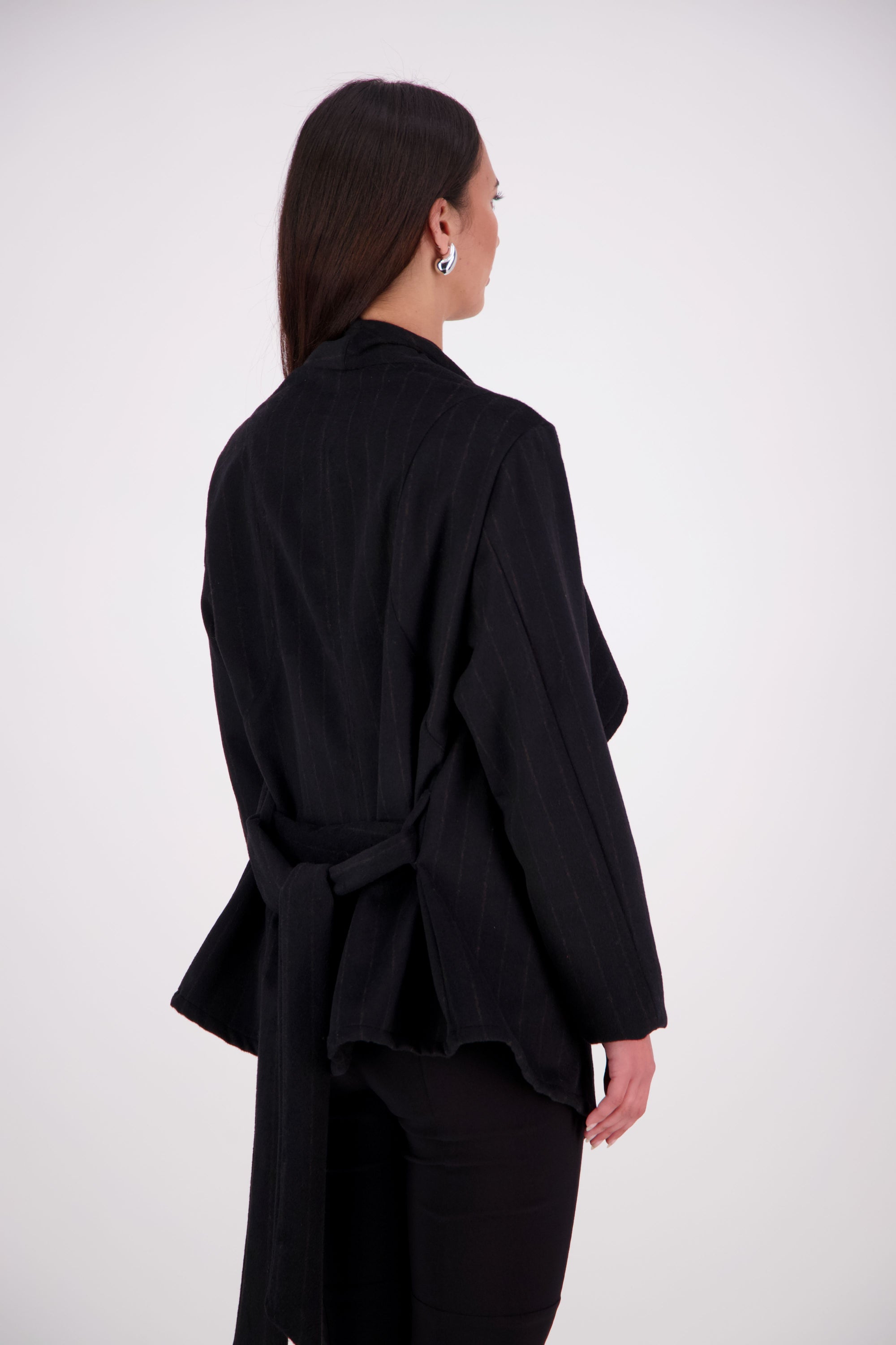 Our NES Ella jacket is a great winter jacket. It has a waterfall front detail.
Features lined sleeves - perfect to stop your knit jumpers from catching up and making the coat more comfortable to wear. A waist tie that you can wrap the coat around you or tie at the back of the coat.