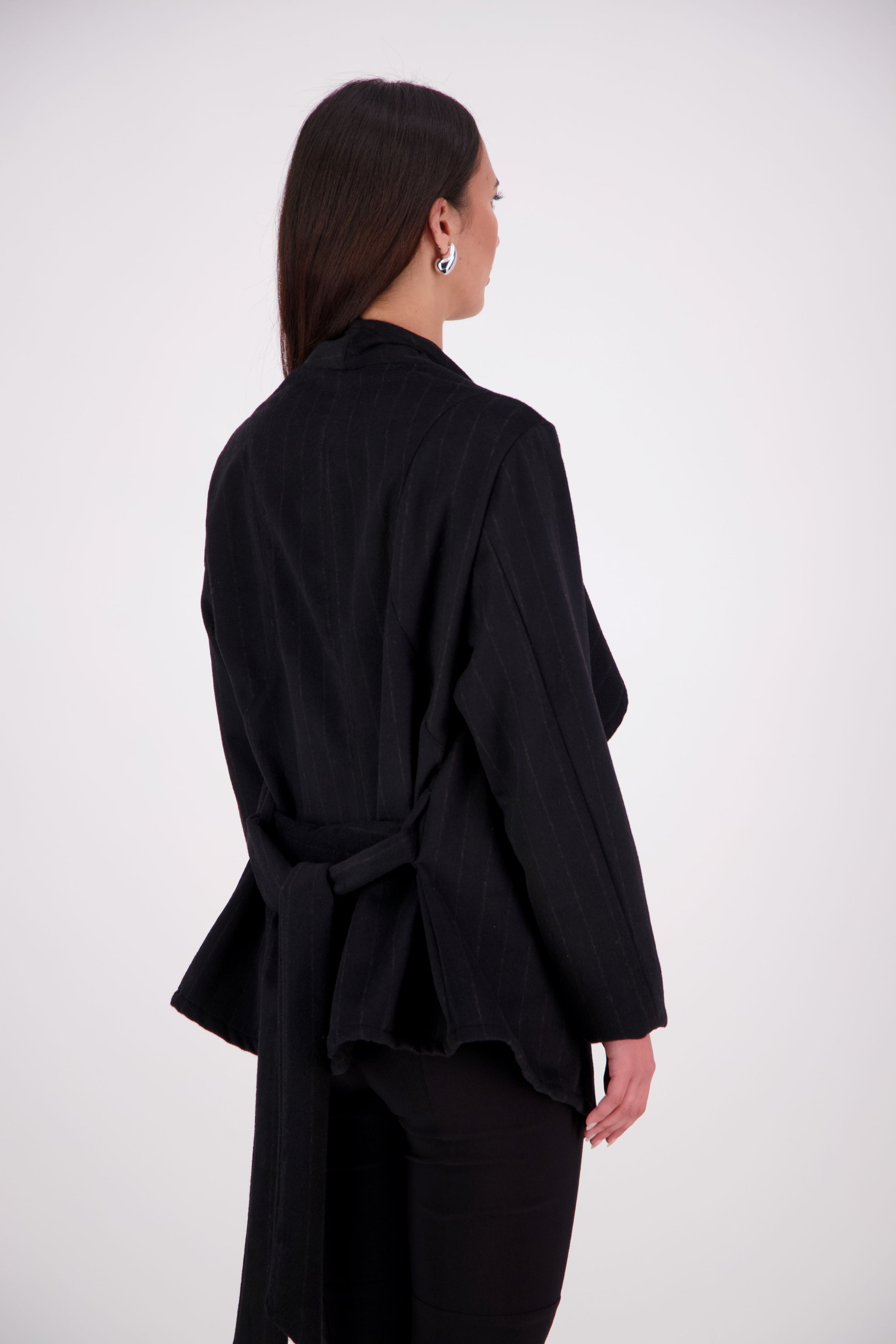 Our NES Ella jacket is a great winter jacket. It has a waterfall front detail.
Features lined sleeves - perfect to stop your knit jumpers from catching up and making the coat more comfortable to wear. A waist tie that you can wrap the coat around you or tie at the back of the coat.