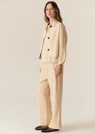 POL | SAGA JACKET : -Classic collar.
-3 button fastening, dyed to match.
-Full length sleeves.
-Two front patch pockets.
-Tonal topstitch details throughout.
-Boxy silhouette.
-Available in Butter, Blue and Ink.
-Style back with the Saga Pant in the matching colour.
-Marisa is 179cm tall and wearing a size 8 in the Ink. Valeria is 177cm tall and a 6-8 wearing a size 8 in the Butter and Blue.
-100% Linen.
