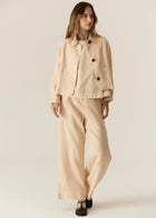 POL | SAGA JACKET : -Classic collar.
-3 button fastening, dyed to match.
-Full length sleeves.
-Two front patch pockets.
-Tonal topstitch details throughout.
-Boxy silhouette.
-Available in Butter, Blue and Ink.
-Style back with the Saga Pant in the matching colour.
-Marisa is 179cm tall and wearing a size 8 in the Ink. Valeria is 177cm tall and a 6-8 wearing a size 8 in the Butter and Blue.
-100% Linen.
